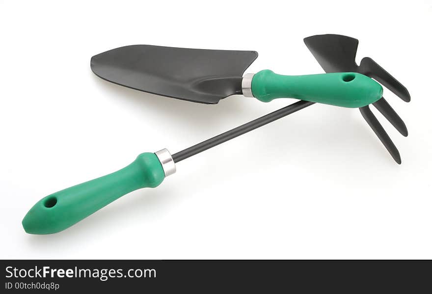 Gardening tools trowel and cultivator for planting and weeding white background. Gardening tools trowel and cultivator for planting and weeding white background