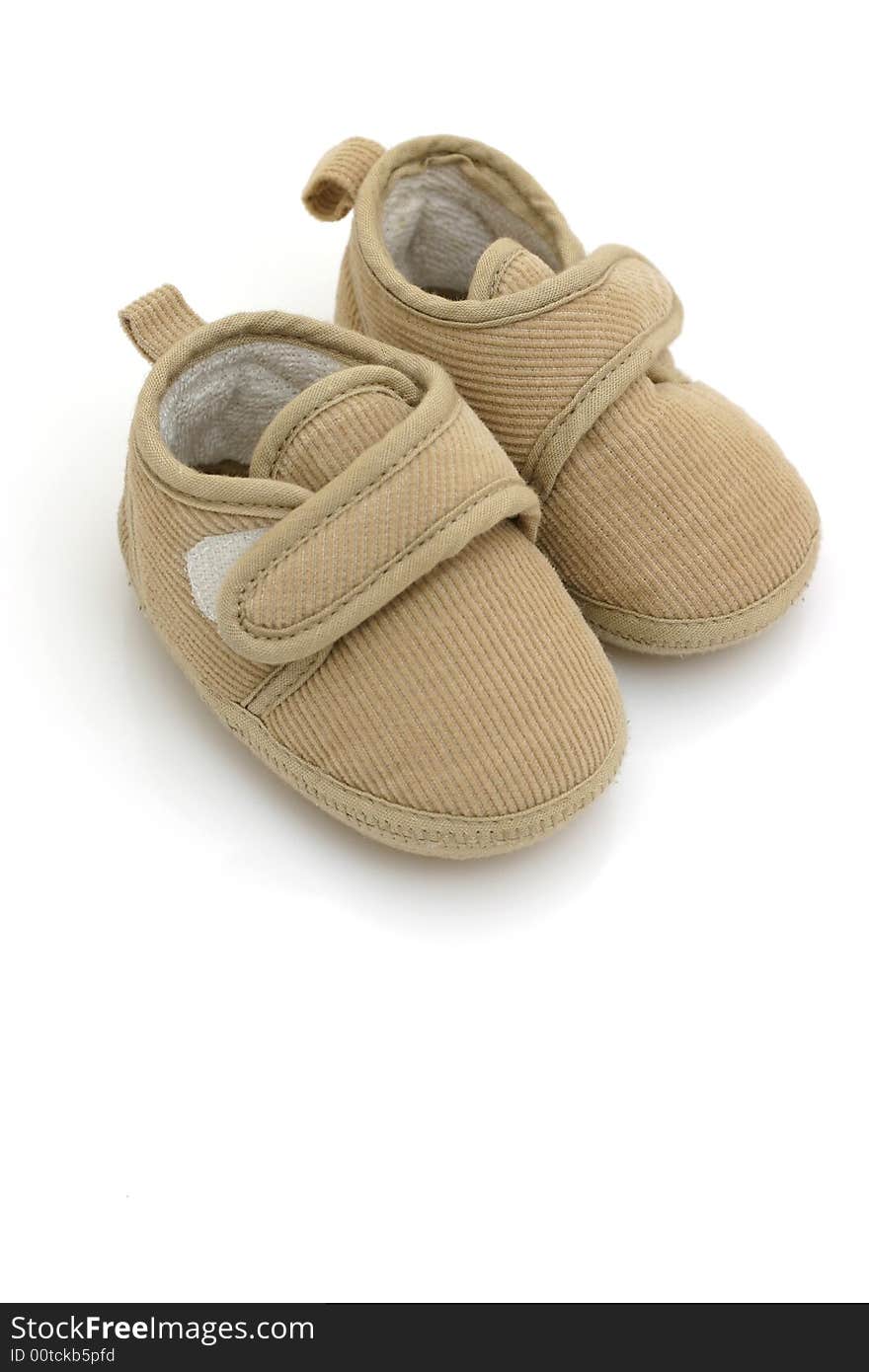 Baby's shoes on white background