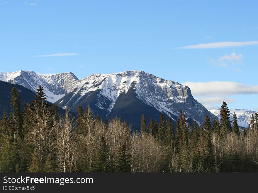 A rugged snow covered mountain in the rocky mountain range, in Jasper, Alberta. A rugged snow covered mountain in the rocky mountain range, in Jasper, Alberta