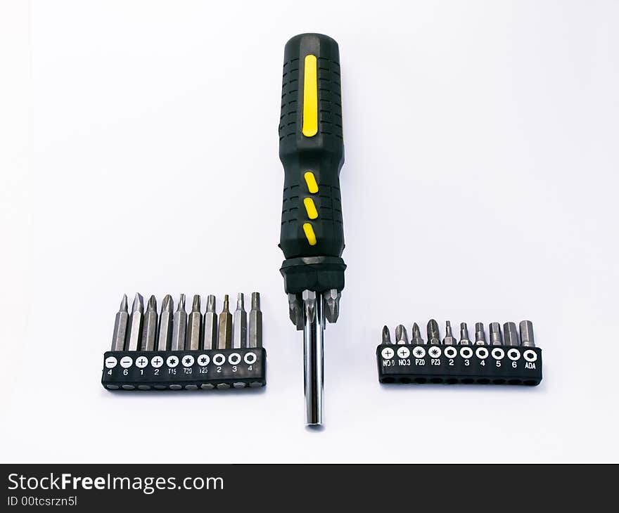 Screwdriver with set of heads on white background