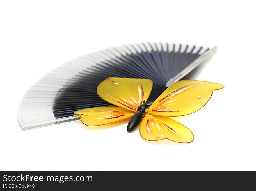 The artificial, plastic butterfly on a fan