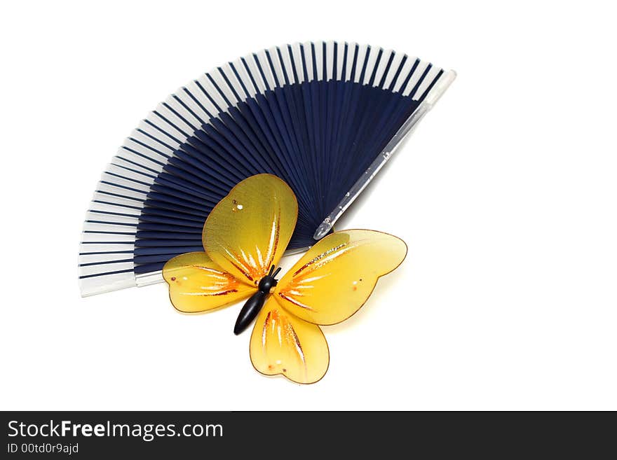 The artificial, plastic butterfly on a fan