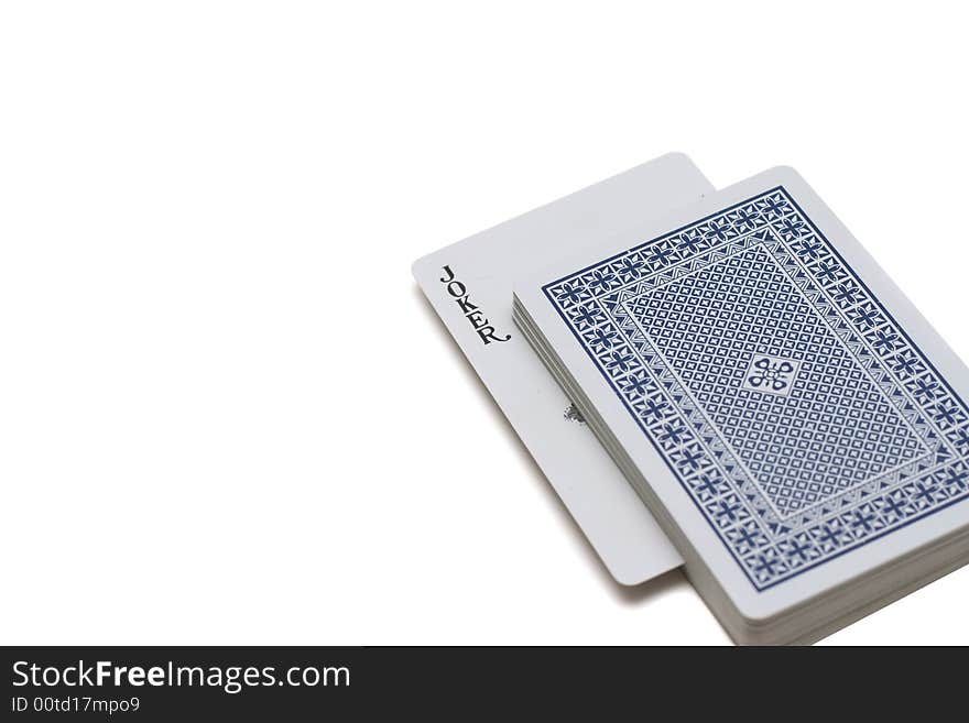 Playing cards laying on a white background