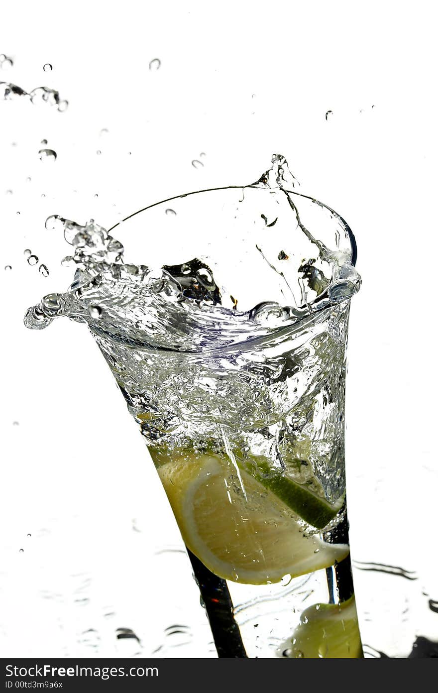 Glass with water and lemon on the white background