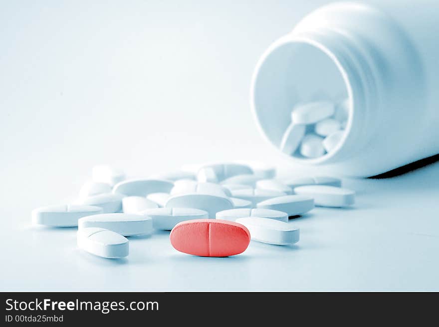 White tablets with bottle on background. White tablets with bottle on background