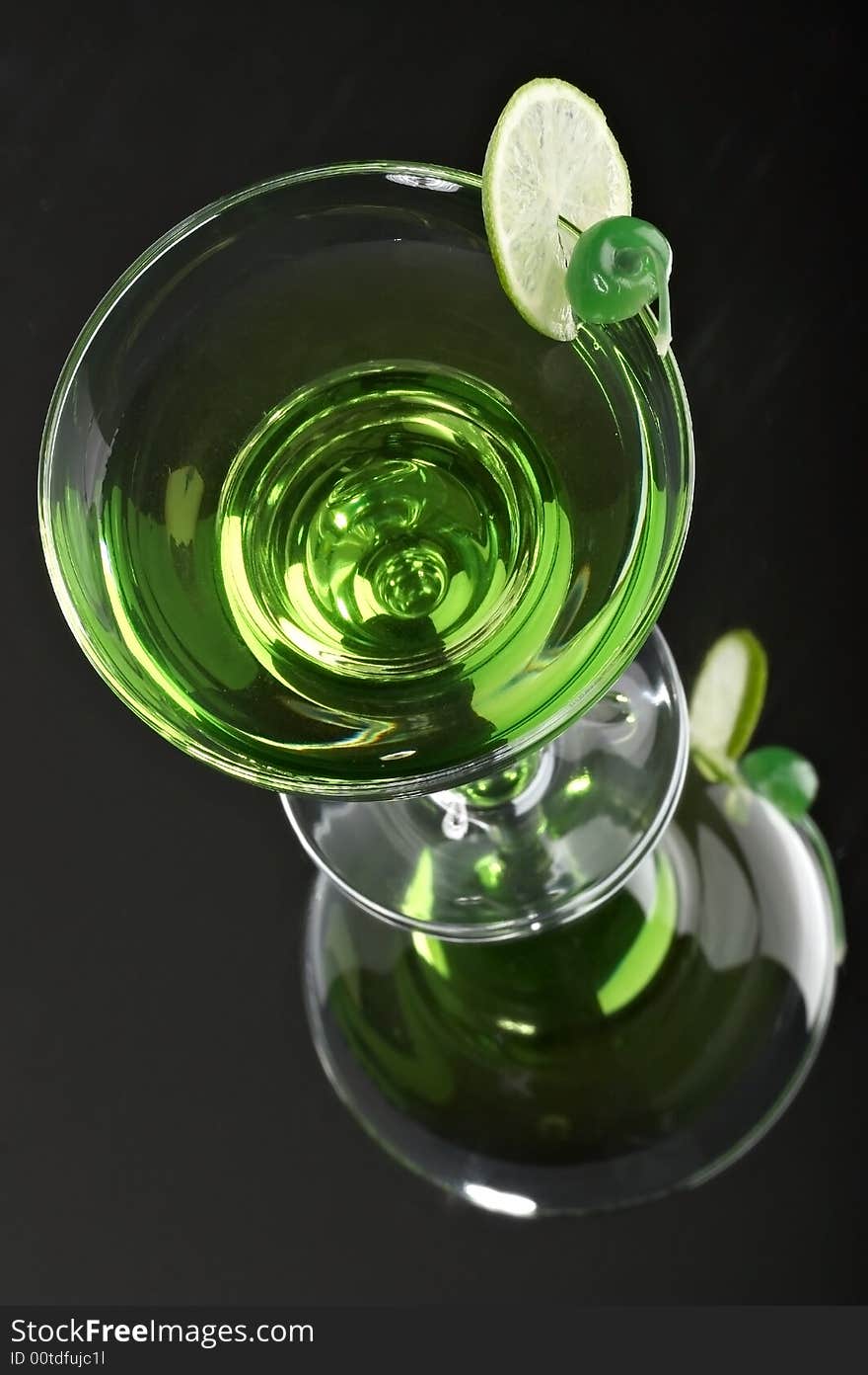 Still life with glass with drink on the black background