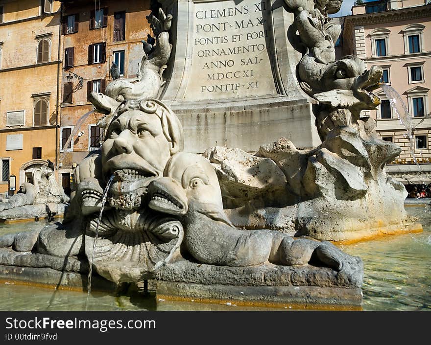 Close-up on a fountain in the city square in front of the Roman Pantheon. Close-up on a fountain in the city square in front of the Roman Pantheon