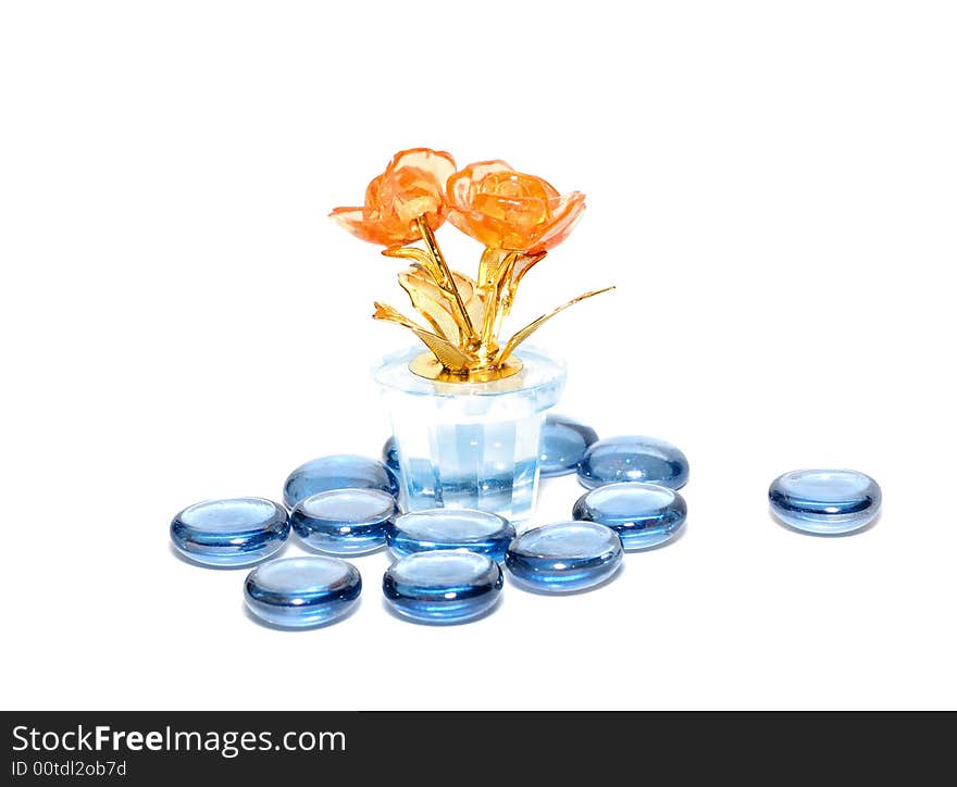 Orange glass flower with blue glass stones. Orange glass flower with blue glass stones