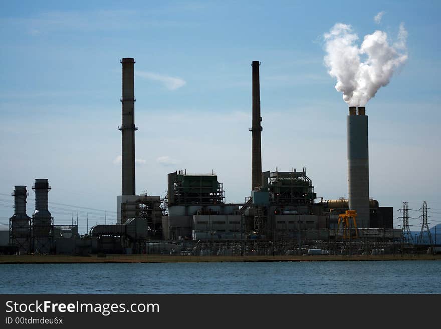 Electricity plant with water in front. Electricity plant with water in front