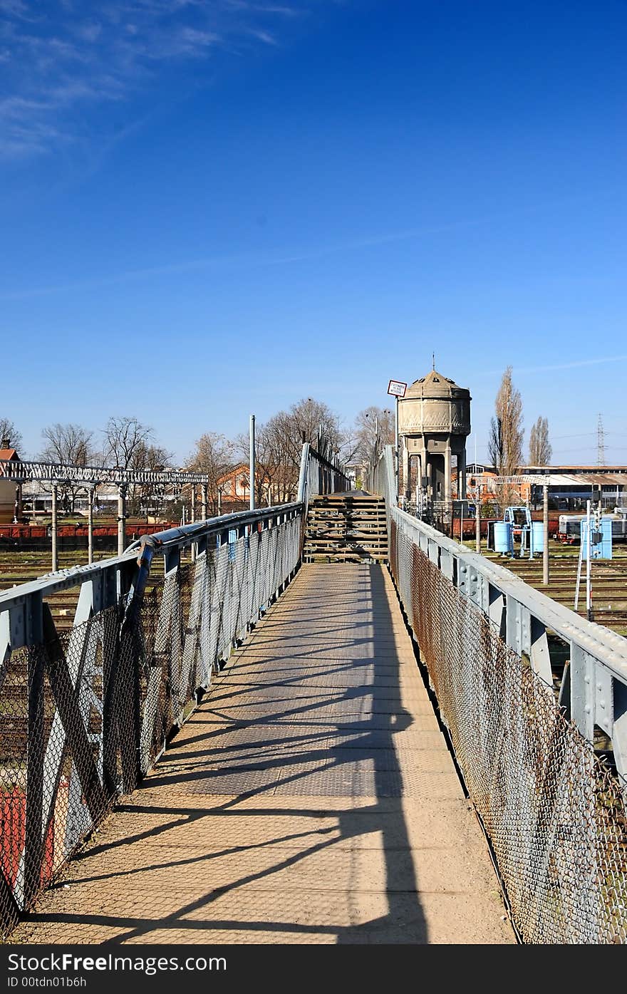 A view with a bridge to an abandoned industrial facility