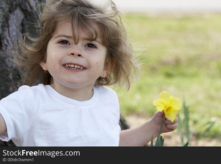 A cute little girl smiling at the camera. A cute little girl smiling at the camera