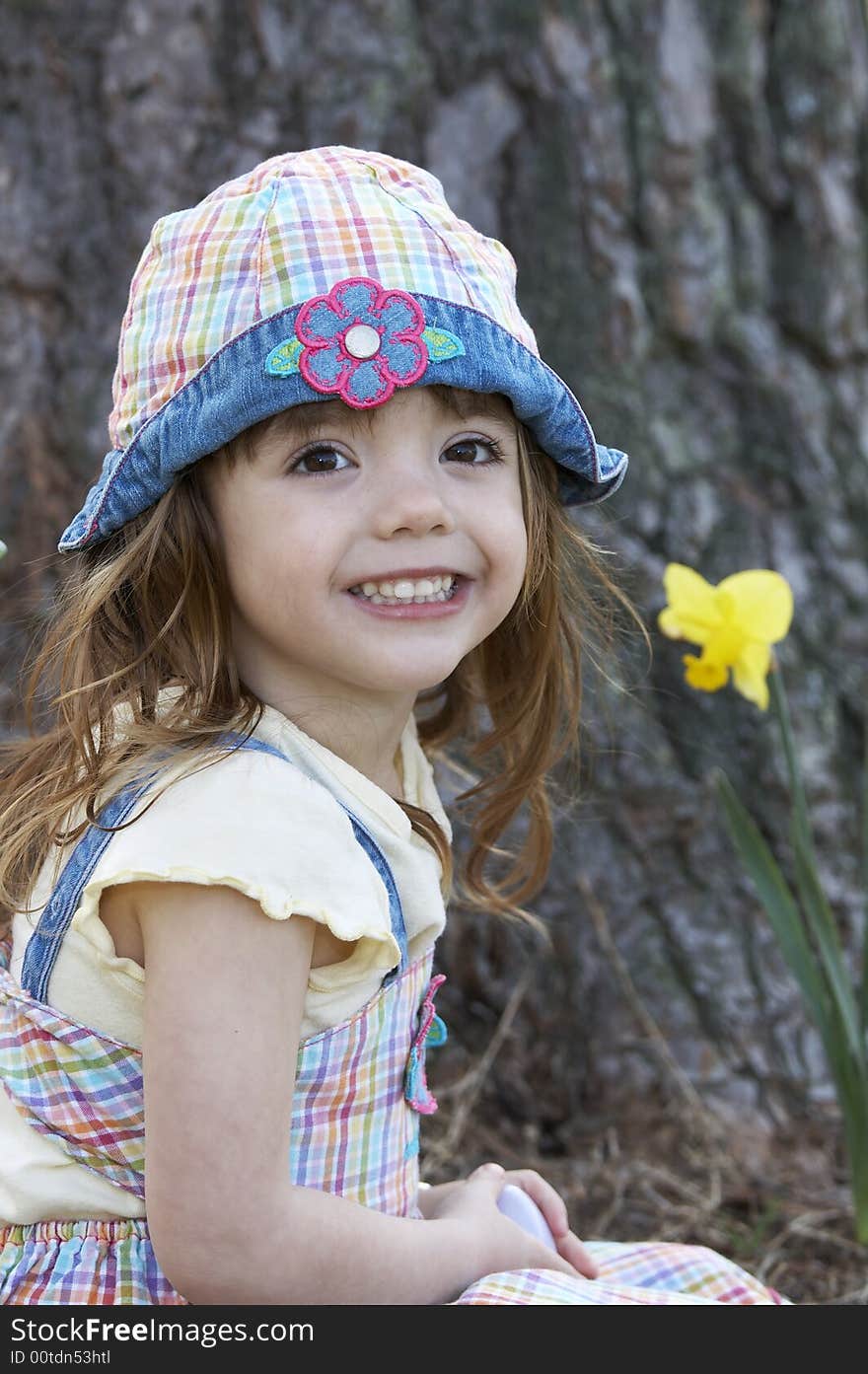 A cute little girl smiling at the camera. A cute little girl smiling at the camera