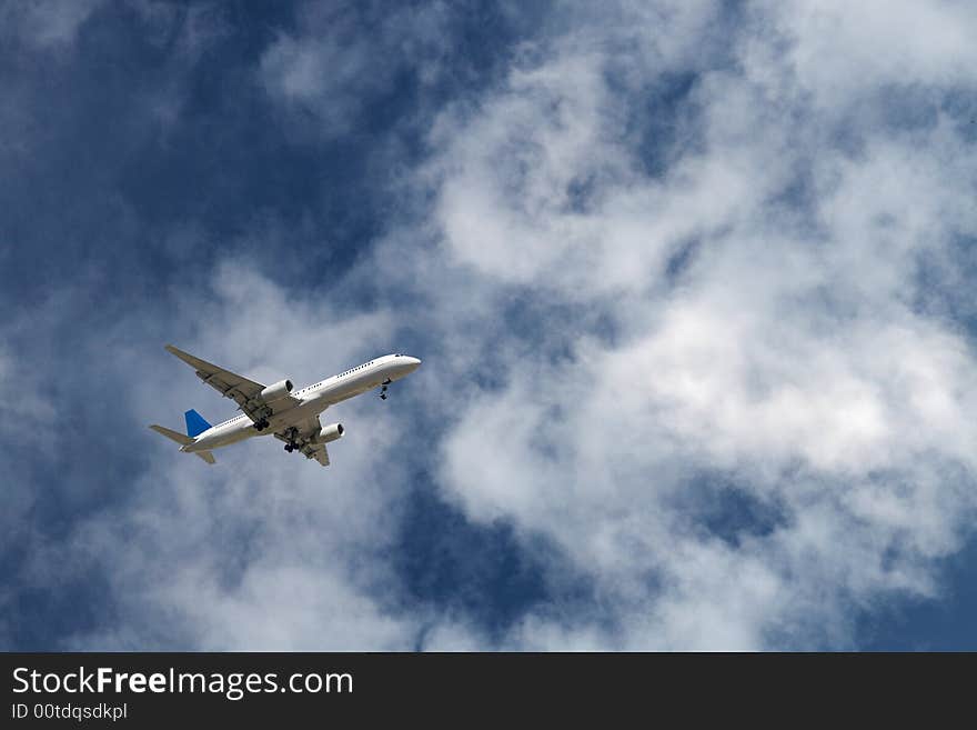 Generic jet airliner in a beautiful cloudy sky