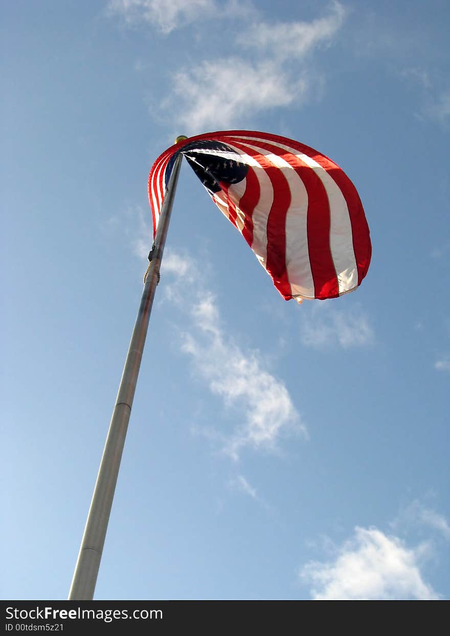 American Flag v1 with Red White and Blue colors set against a blue sky with white clouds.