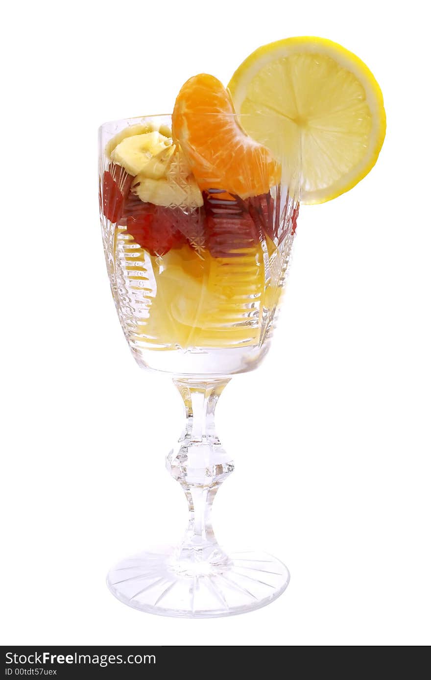 Fruits salad in the cup on white