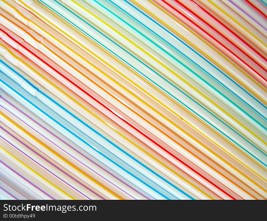 Close-up diagonal pattern of colorful straws, colorful background. Close-up diagonal pattern of colorful straws, colorful background