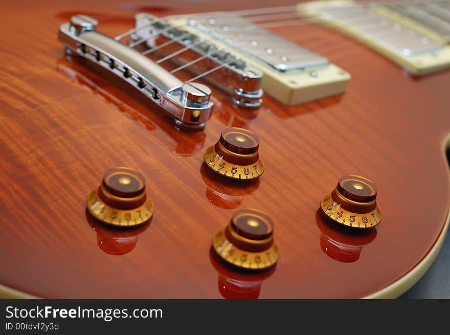 Knob focus on a Les Paul guitar body. Knob focus on a Les Paul guitar body