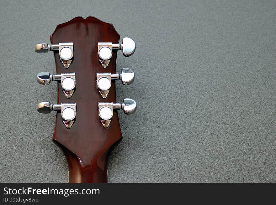 Tuning machines on a Les Paul guitar neck. Tuning machines on a Les Paul guitar neck