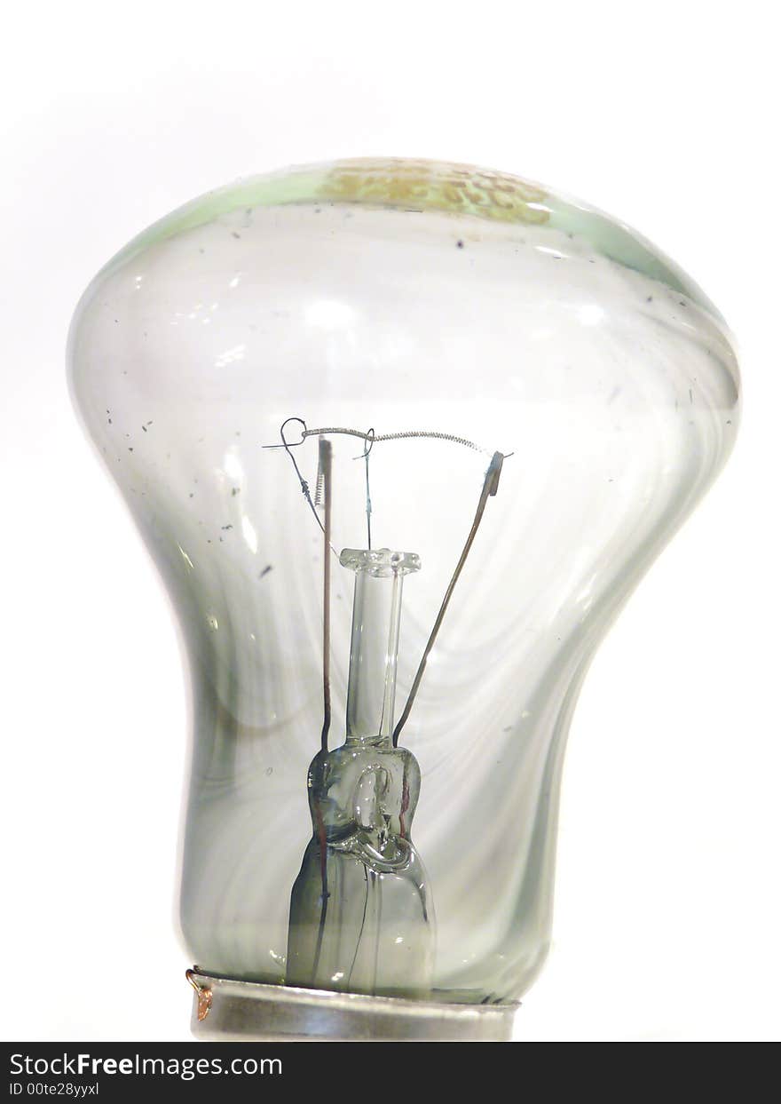 The burned-out light bulb on a white background. The burned-out light bulb on a white background.