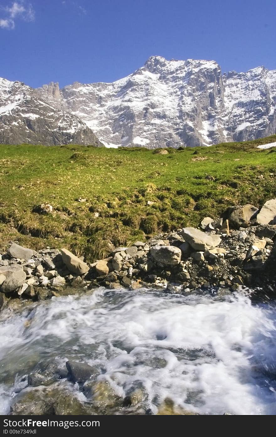 Spring stream water on the alpine hills. Spring stream water on the alpine hills