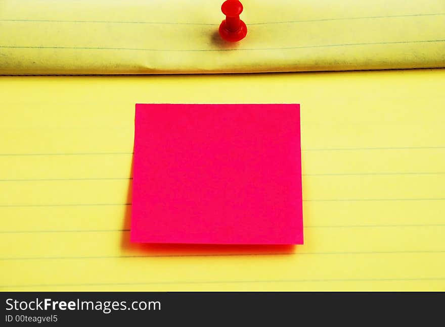 Stock pictures of a notepad with a pin and a post sticky note. Stock pictures of a notepad with a pin and a post sticky note