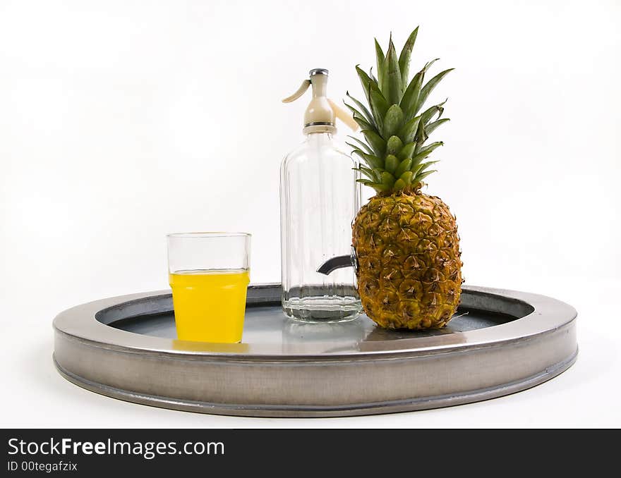 Juicy ananas with soda bottle