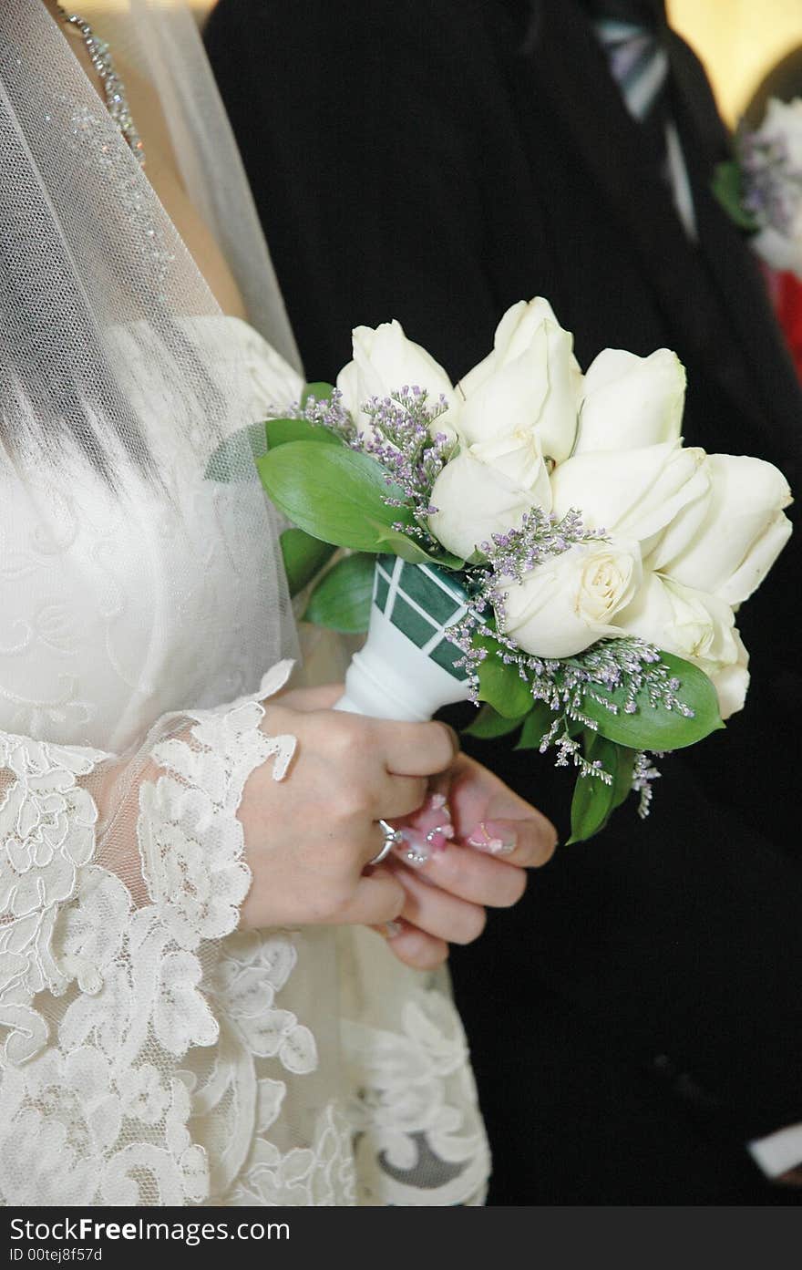 Bride holding white roses wedding flower close up. Bride holding white roses wedding flower close up