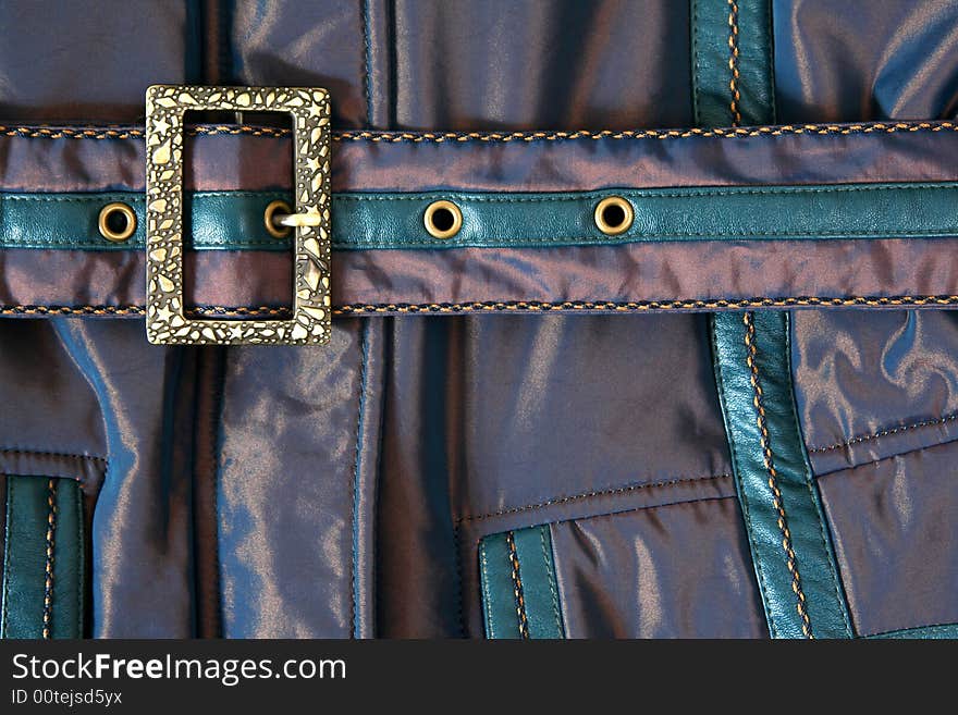 Belt with metal buckle on jacket