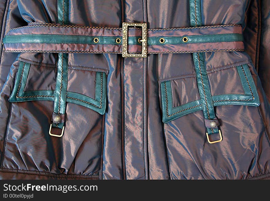 Belt and pocket with metal buckle on jacket