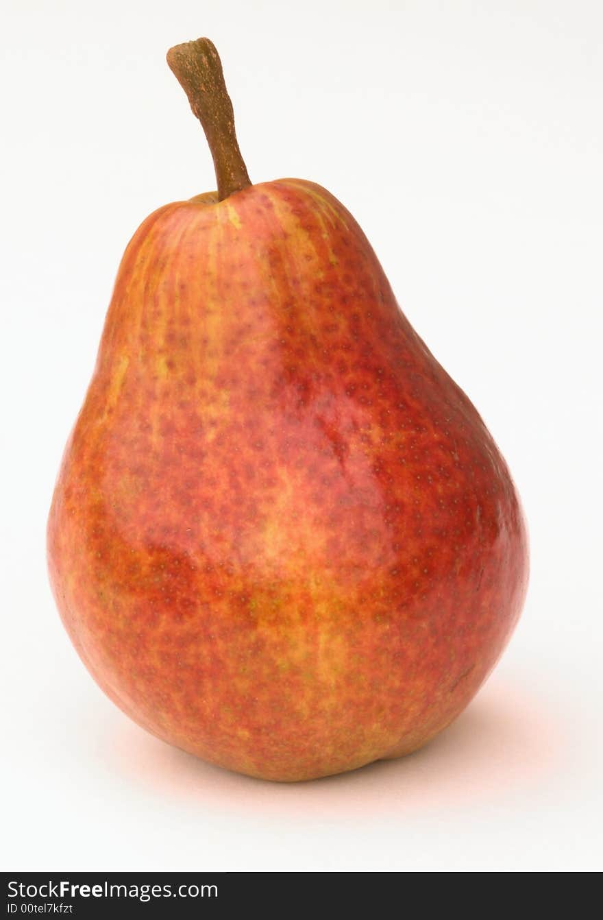 Picture of this red pear has been taken just after it had been bought in the supermarket. Picture of this red pear has been taken just after it had been bought in the supermarket