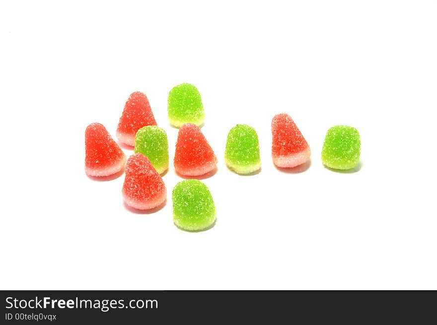 Bright colorful candies forming a left arrow.