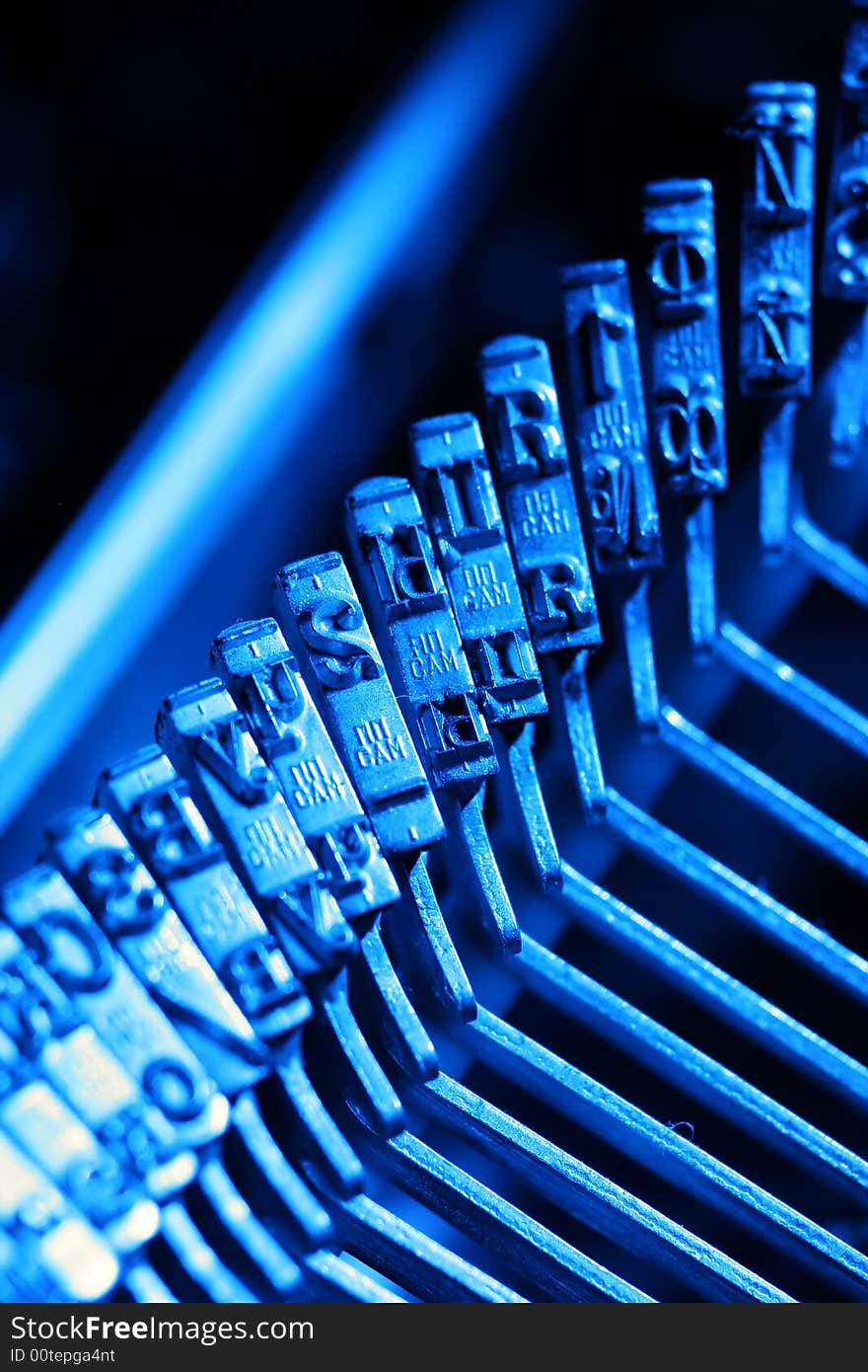 Letters of russian typewriter in blue light