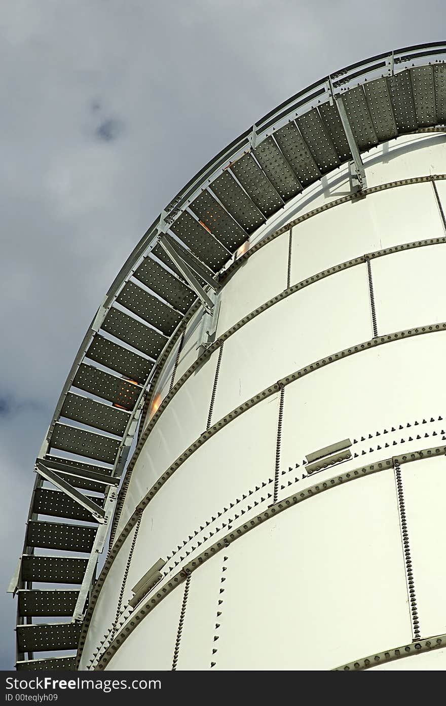 Stairs circling around a storage tank seen from below. Stairs circling around a storage tank seen from below