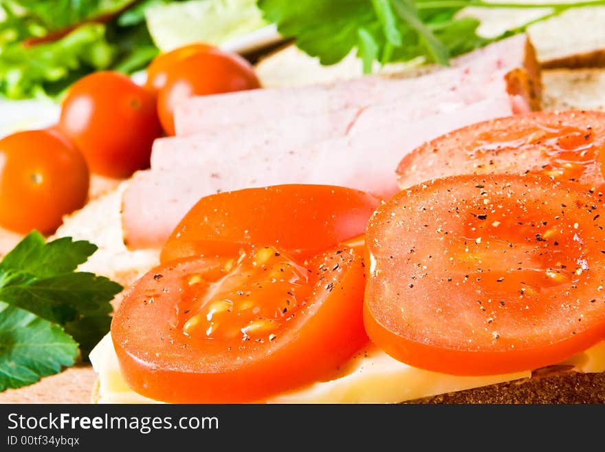 Tomatoes, ham and cheese sandwiches. Tomatoes, ham and cheese sandwiches