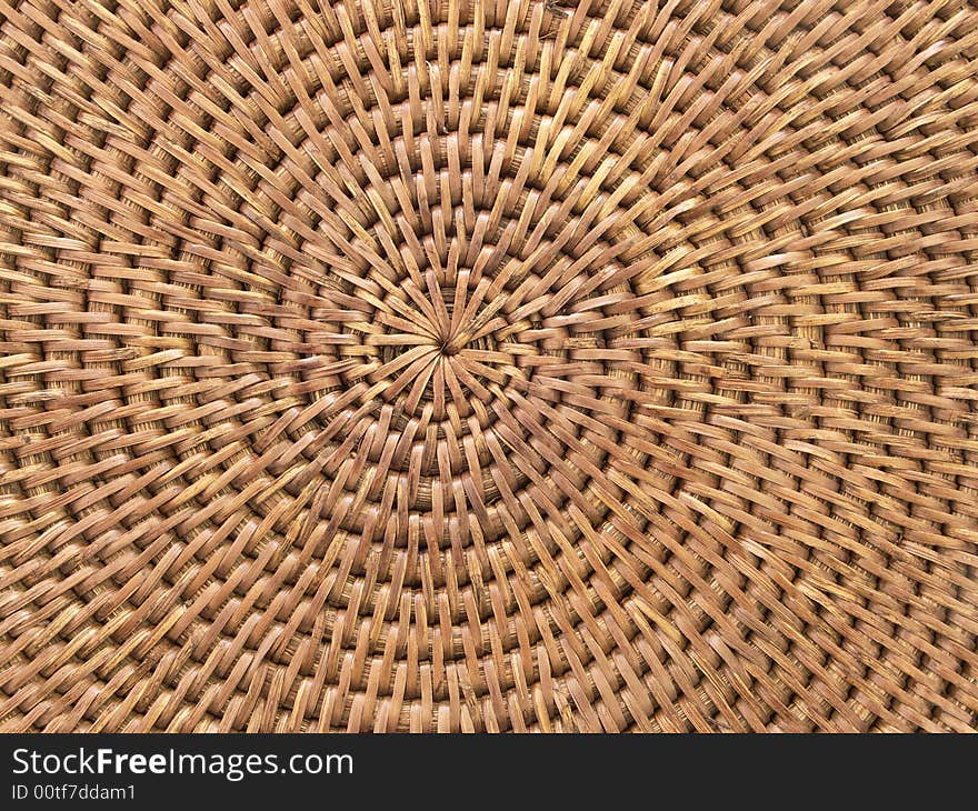 Round weaving from rattan, on a white background