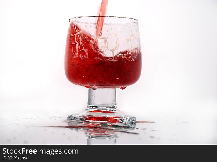 Glass of rad motion wine on the white background. Glass of rad motion wine on the white background