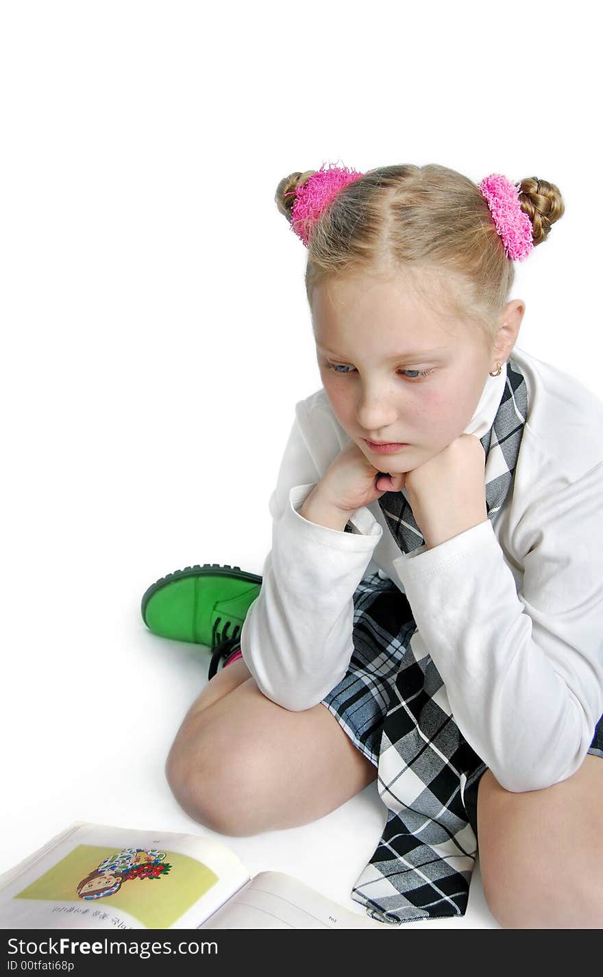 A girl in school uniform at homework