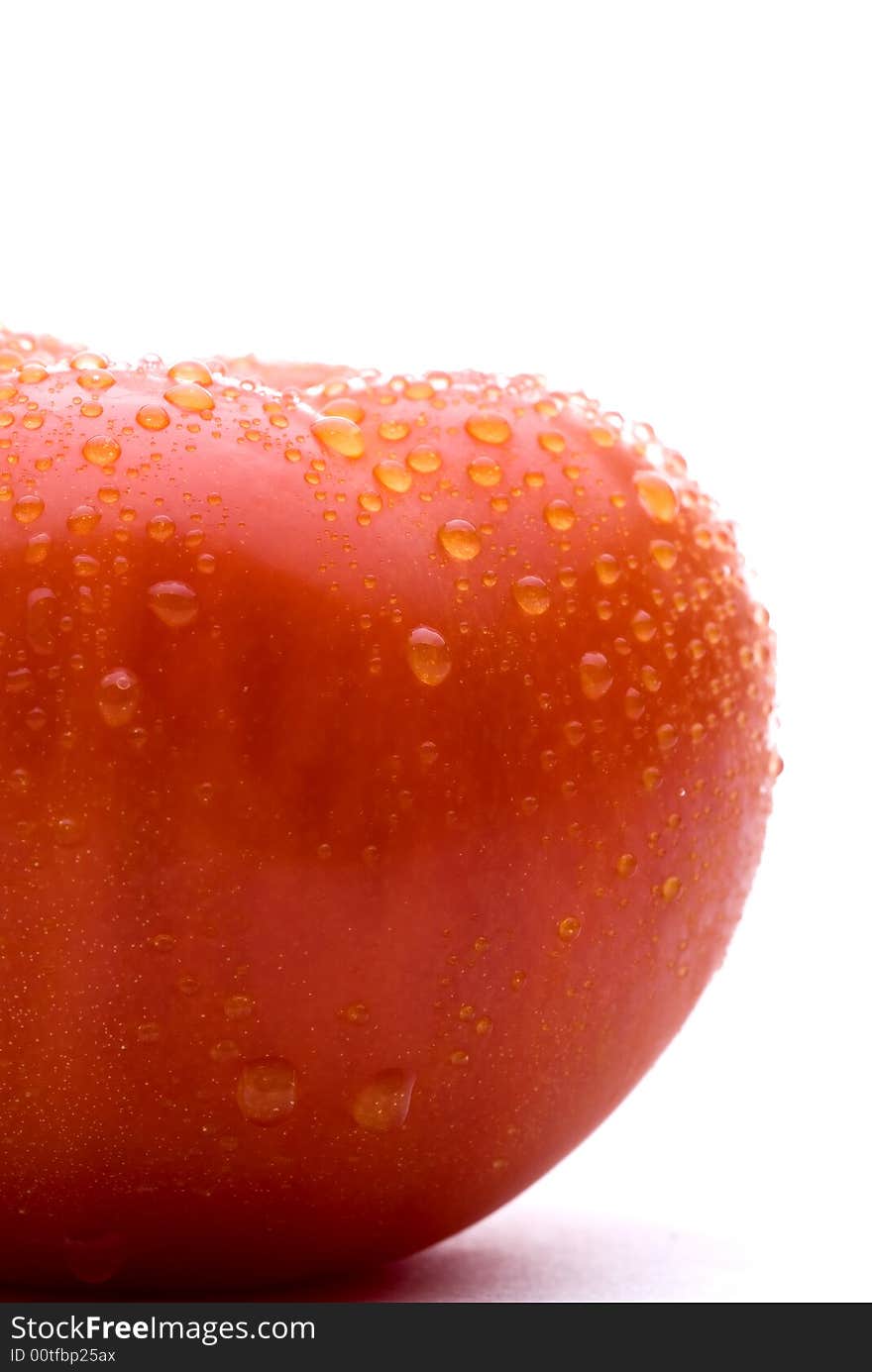 Macro of a fresh red tomato on a white background