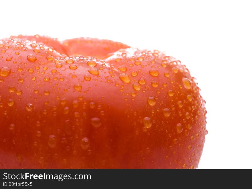 Macro of a fresh red tomato on a white background