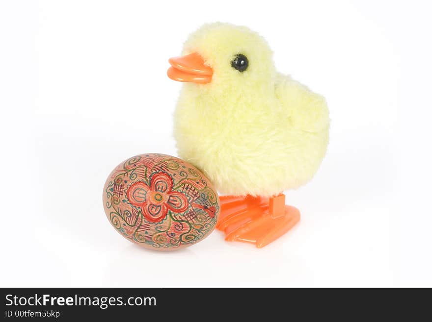 Little yellow chick and egg isolated on white background