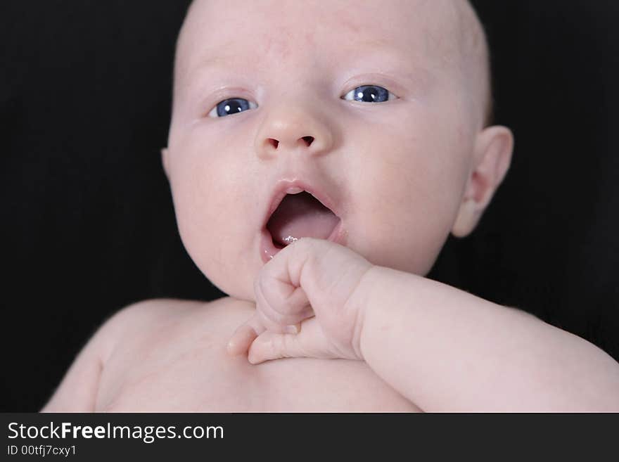 Newborn Baby on black Background