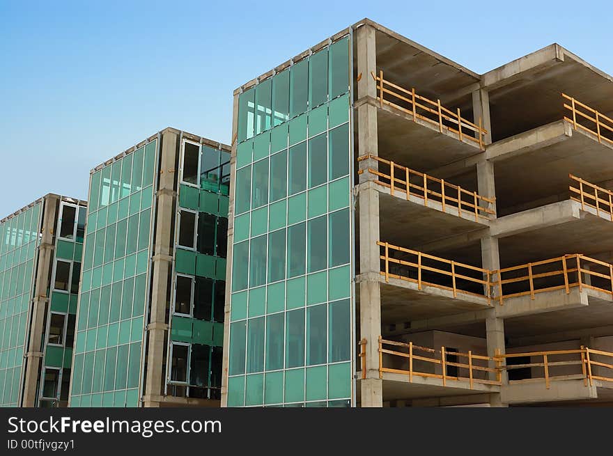 Few uncomplete houses from glass and concrete