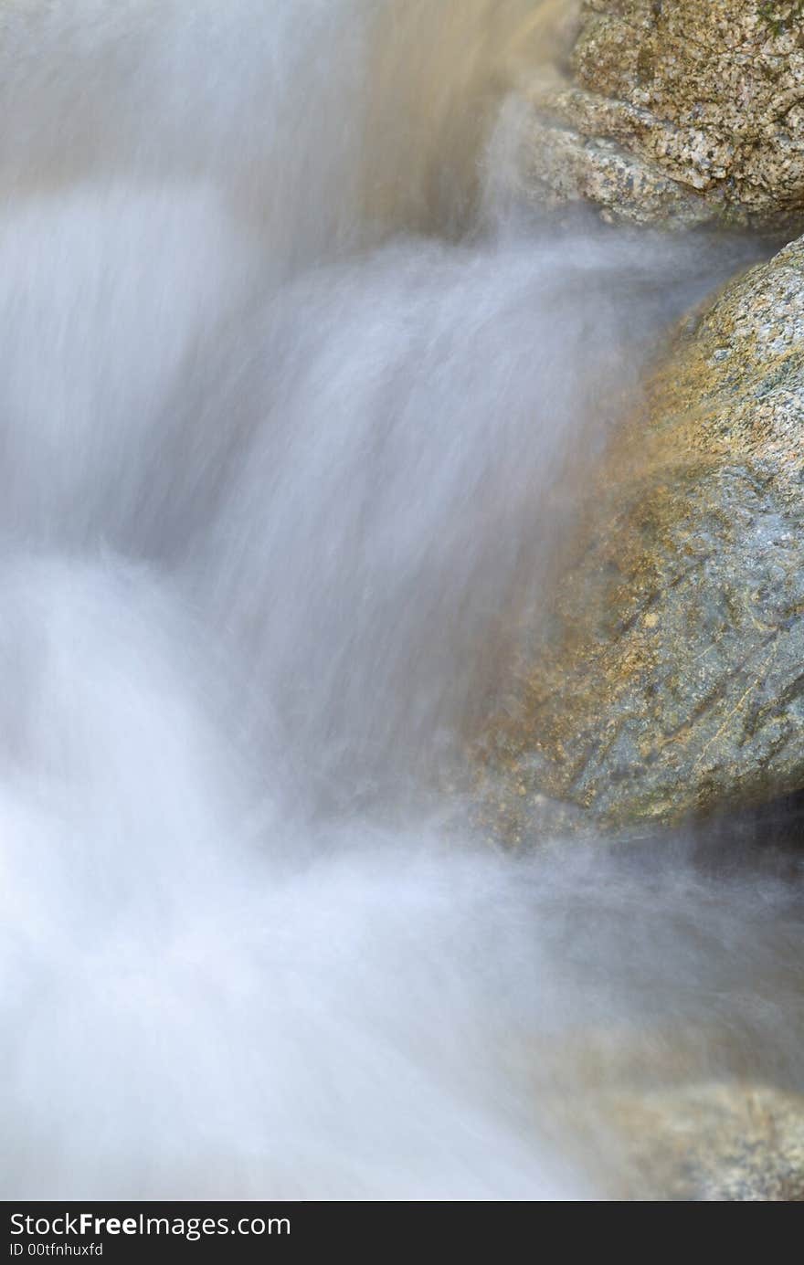 Long exposure photo of running water over rocks. Long exposure photo of running water over rocks