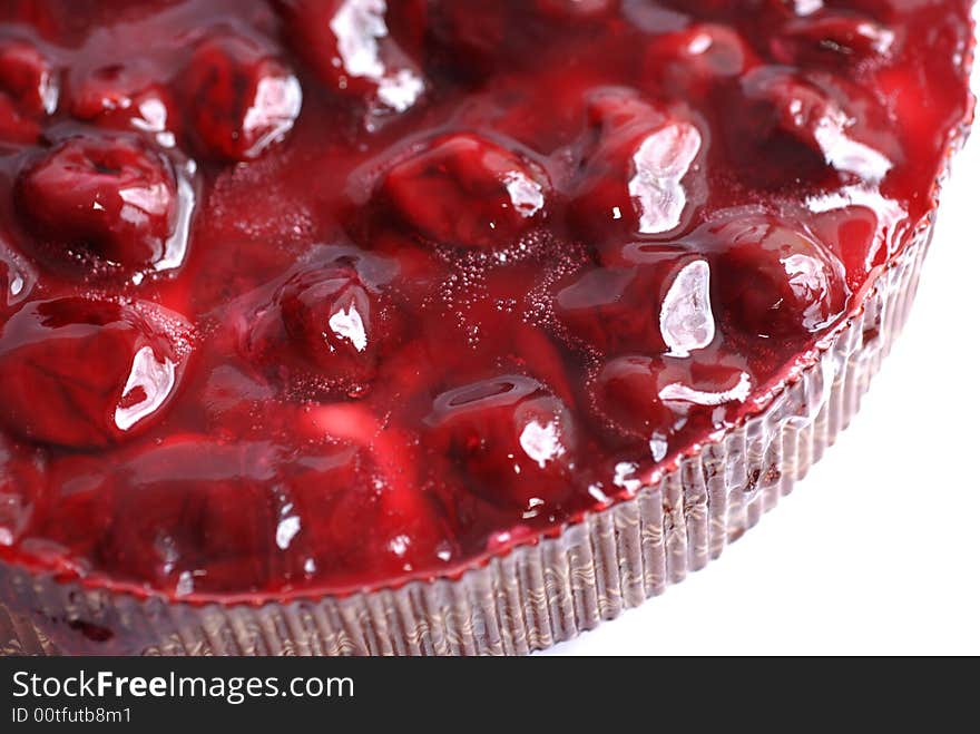 Topping of cherry cake close up.