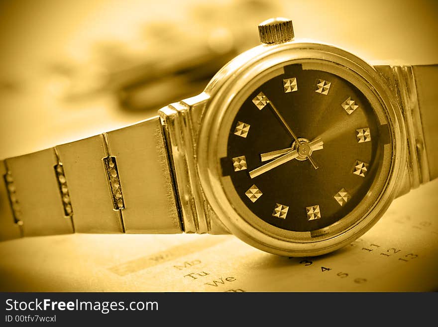 Sepia tint watch time concept with caledar