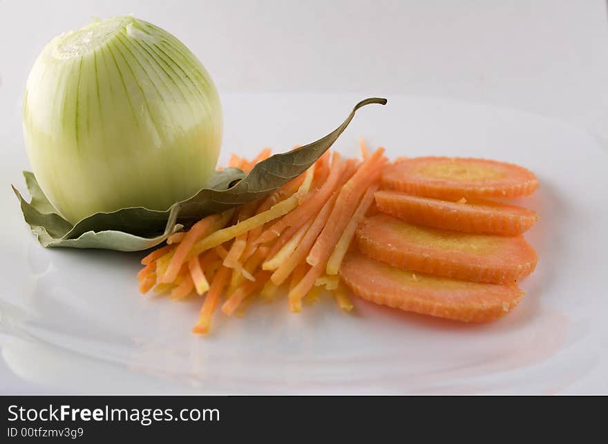 Onion, carrot on the table. Onion, carrot on the table