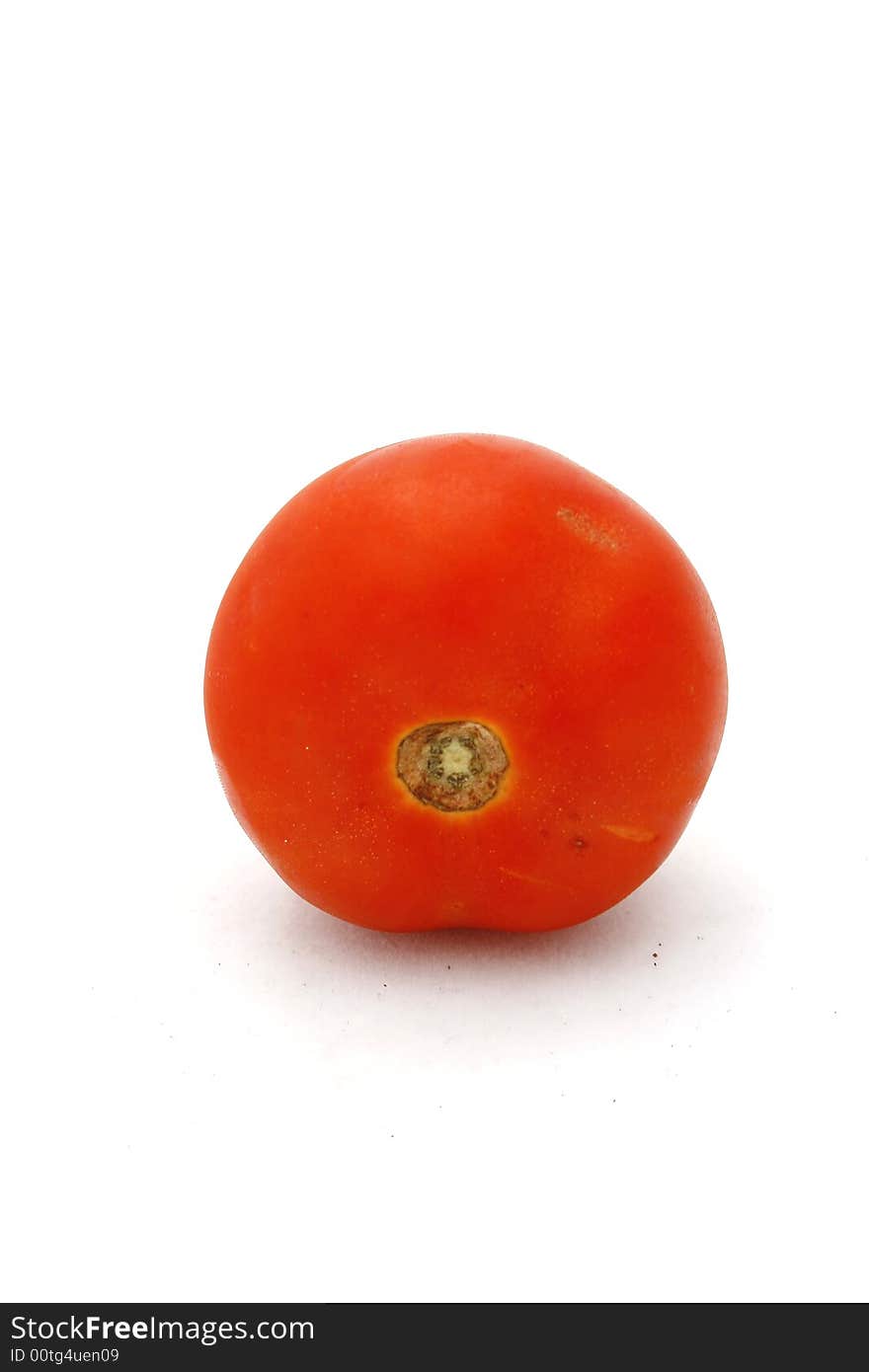 A fresh tomato isolated on a white background