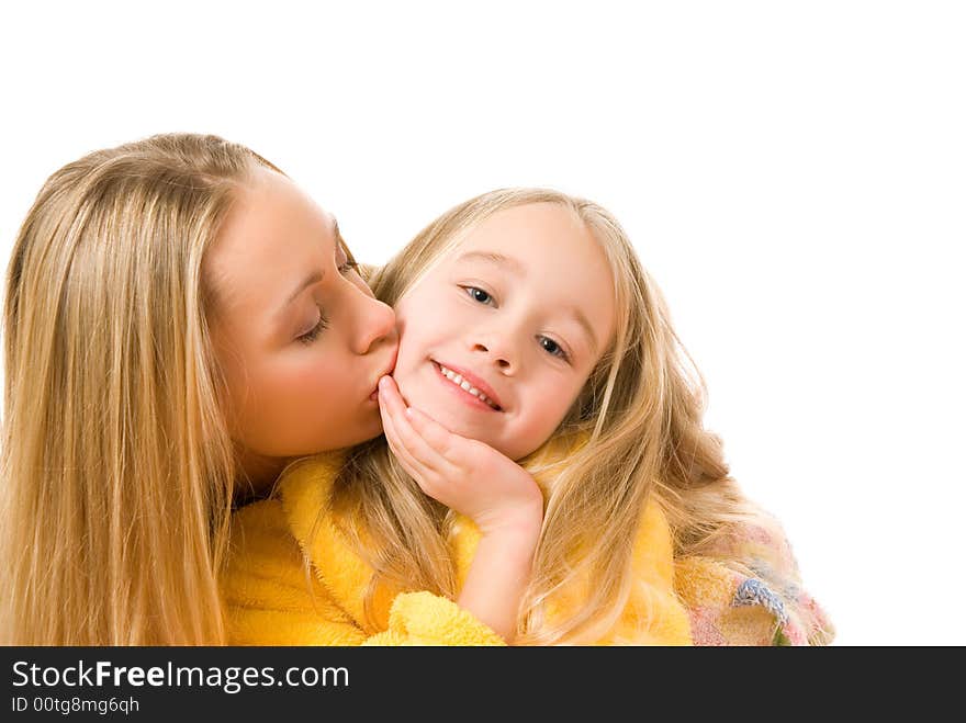 Mother kissing her daughter