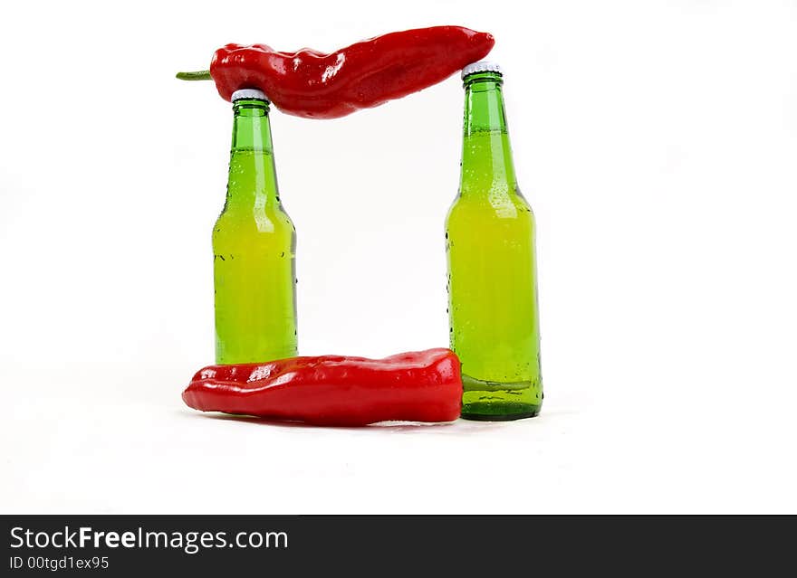 Combination of cold beer and spicy chili paprika's. Combination of cold beer and spicy chili paprika's