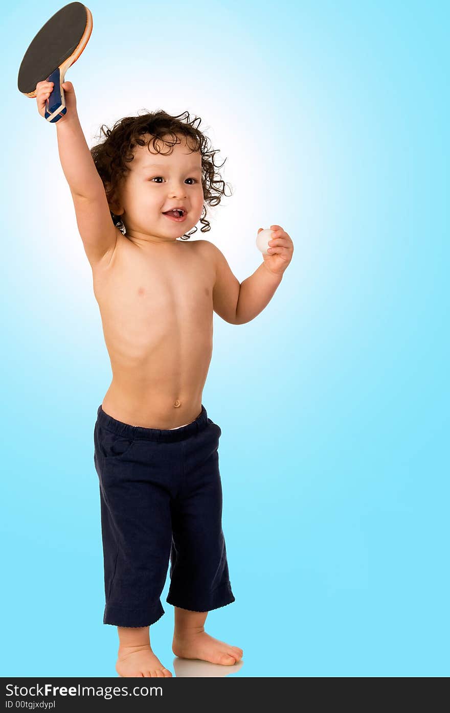 The child plays table tennis, on blue background. The child plays table tennis, on blue background.